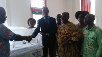Some executives of the National Lottery Authority presenting the incubators to the hospital