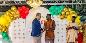 Ghanaian football leged, Asamoah Gyan picking up his award