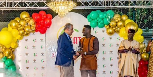 Ghanaian football leged, Asamoah Gyan picking up his award