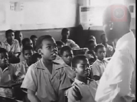 A young student questions Louis Armstrong about his career
