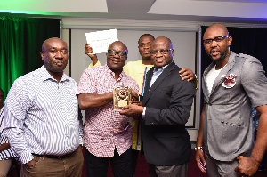 Francis Agbonlahor, MD, GGBL presenting award to Mr. Boakye Yiadom and others