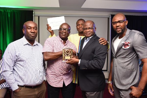 Francis Agbonlahor, MD, GGBL presenting award to Mr. Boakye Yiadom and others