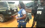 Ama Addo is being taken away by the police from the election grounds