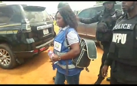 Ama Addo is being taken away by the police from the election grounds