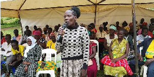 A resident speaks during the village meeting in which health officials attended