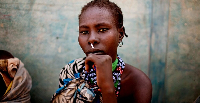 A woman from the Murle tribe awaits food distribution in a town in South Sudan in Feb. 2,  2012