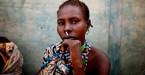 A woman from the Murle tribe awaits food distribution in a town in South Sudan in Feb. 2,  2012