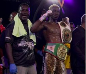 Joshua Commey (holding the titles) is the reigning National Lightweight Champion