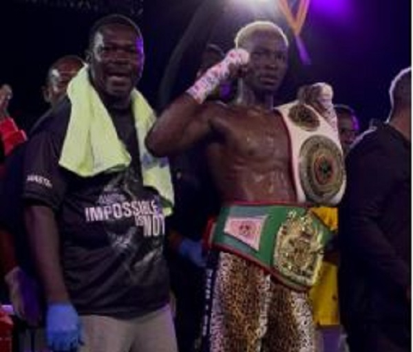 Joshua Commey (holding the titles) is the reigning National Lightweight Champion