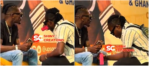 A picture of Abongo tasting a drink before handing it to Shatta Wale A picture of Abongo tasting a drink before handing it to Shatta Wale