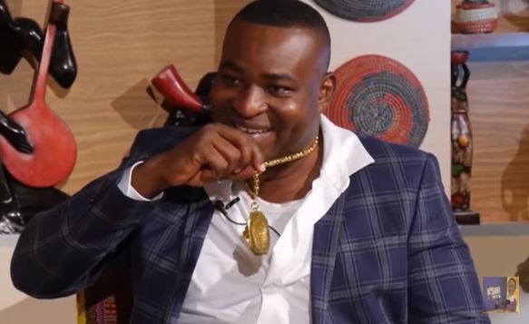 Chairman Wontumi shows off his gold necklace on the KSM Show