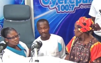 Couple in white attire kneel before accused mother