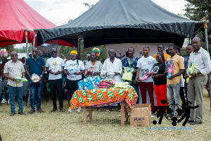 Facilitators of the football clinic in a photo with the participants