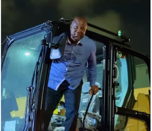 Ibrahim Mahama joined his workers to offload new mining equipments