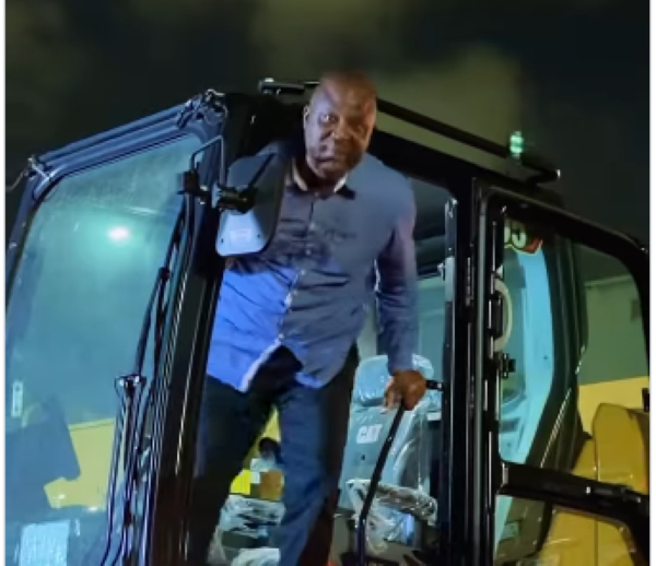 Ibrahim Mahama joined his workers to offload new mining equipments