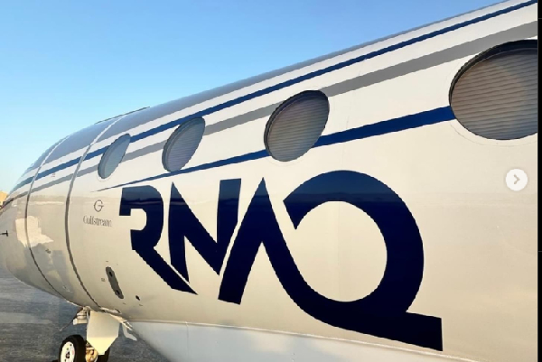 Quaye’s private jet, boldly branded with his initials, RNAQ
