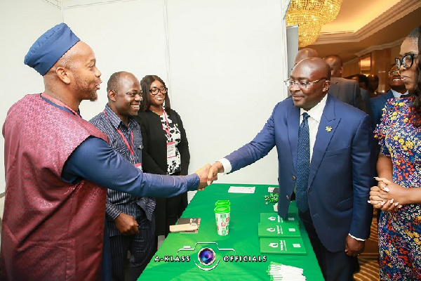 Dr Mahamudu Bawumia exchanging pleasantries with Mr Darryl Abraham Mawutor of Taptap Send Africa