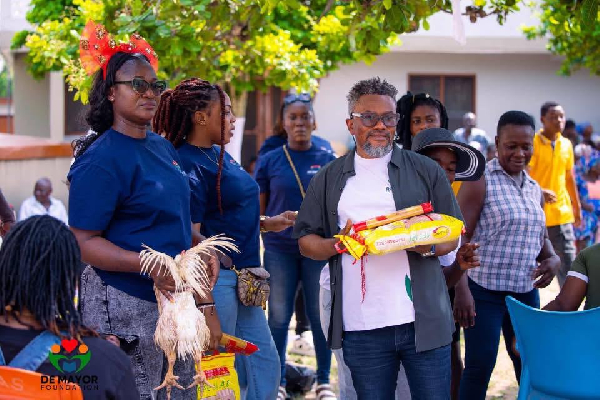 David Selasie Anthony with some of his team members as they feted the widows