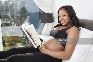 Black Woman Pregnant Reading