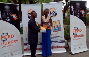 Montia and Dr. Tetteh launching the book series officially at the Accra International Press Centre