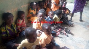Salifu-Krom Primary School pupils study on the floor due to lack of furniture
