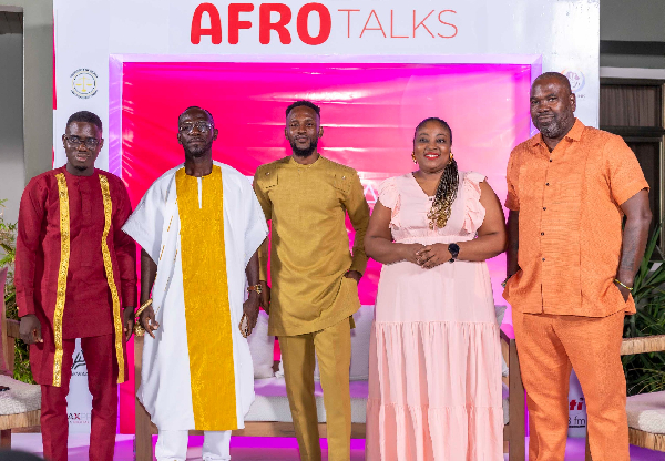 Okyeame Kwame (2L) and other panellists from the soiree