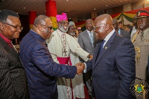 President Akufo-Addo exchanging pleasantries with some clergymen