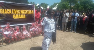 Mrs Elizabeth Ofosu-Adjare walking on after laying a wreath