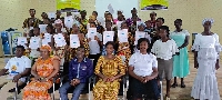 A group picture of the graduates, their parents and district teachers