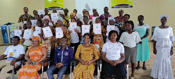 A group picture of the graduates, their parents and district teachers