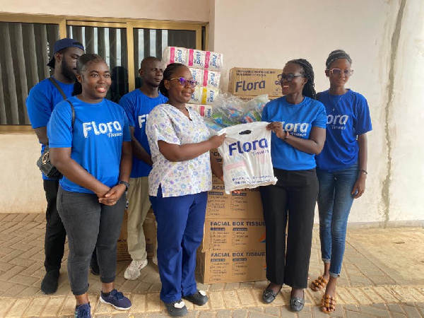 Staff of Flora Tissue making the donation