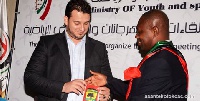 Opoku Nti receives the honour from Libya's sports minister