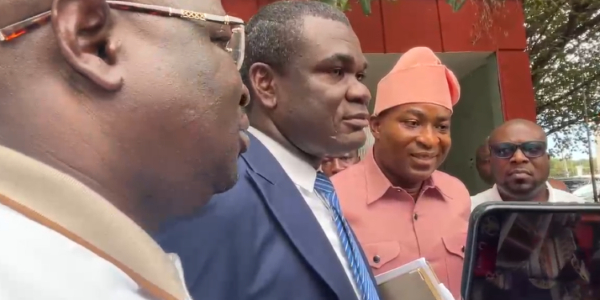 Lawyer Enoch Anhwere Afoakwah in the middle with Chairman Wontumi standing on his right