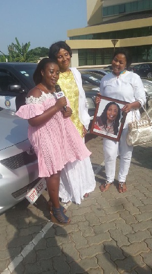 Gifty Osei with her mother and other at the car park