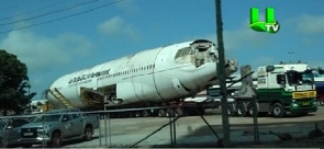 The plane preparing to be towed away