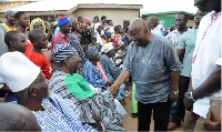 Nana Addo in a handshake with the Chief of Loggu