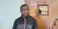 Godfrey Muwumuza, a teacher at Kabojja Junior School in the dock in court