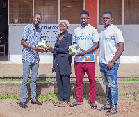 Mashood Djabeng (left) receiving the footballs on behalf of the department