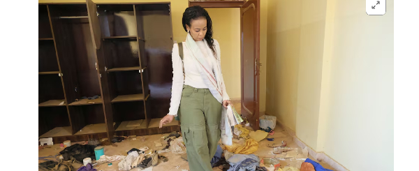 Sudanese journalist, Shamael Elnoor, inspects her room at home after it was destroyed