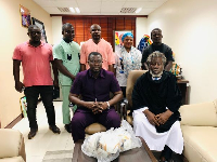 Ashaiman MP (seated left) with Rabii temple leader Nyame Somafo Yawoh (seated right)