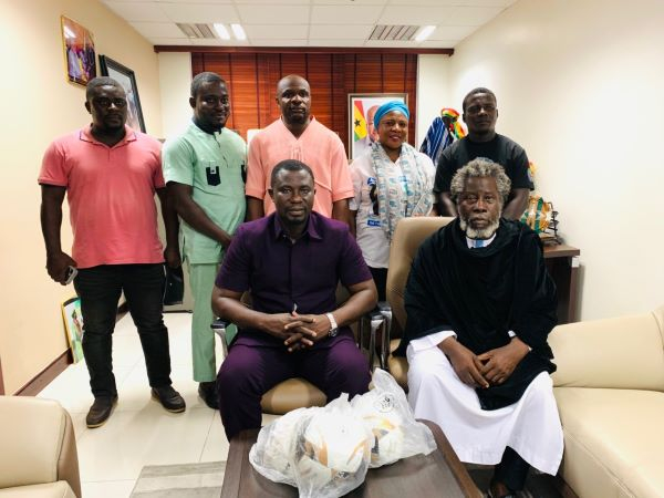 Ashaiman MP (seated left) with Rabii temple leader Nyame Somafo Yawoh (seated right)