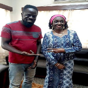 Ofori Amponsah in a pose with Nana Konadu Agyeman Rawlings