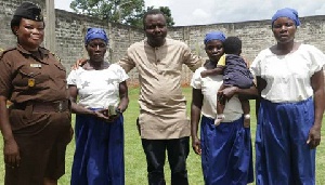 Ibrahim Oppong Kwarteng with the mother and her two daughters rescued from prison