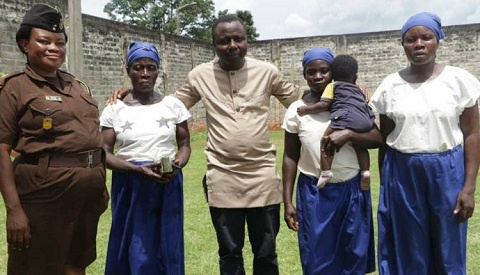Ibrahim Oppong Kwarteng with the mother and her two daughters rescued from prison
