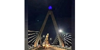 The Tanzanite Bridge at night after it was rebranded with the gemstone's symbol