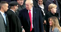 A photo of King Mohammed VI and President Trump exchanging a handshake