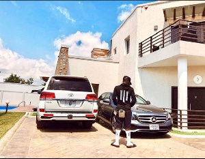 Shatta Wale, one of Zylofon signed artist showcasing his cars and mansion