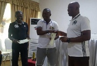 Winfred Dormon receiving his certificate after the course
