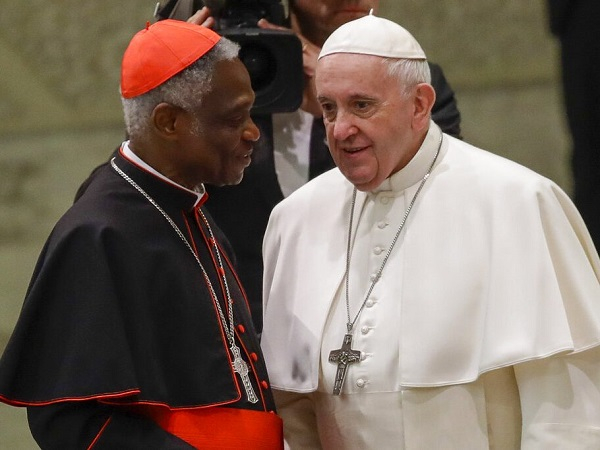 Cardinal Peter Appiah Turkson (L) with Pope Francis