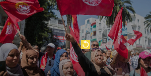 Supporters of the Tunisian General Labor Union (UGTT) gather during a rally outside its headquarters